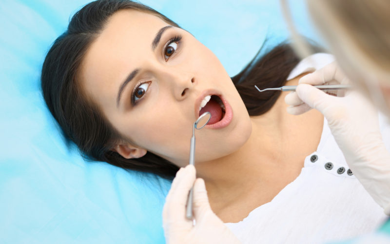Woman getting dental care done